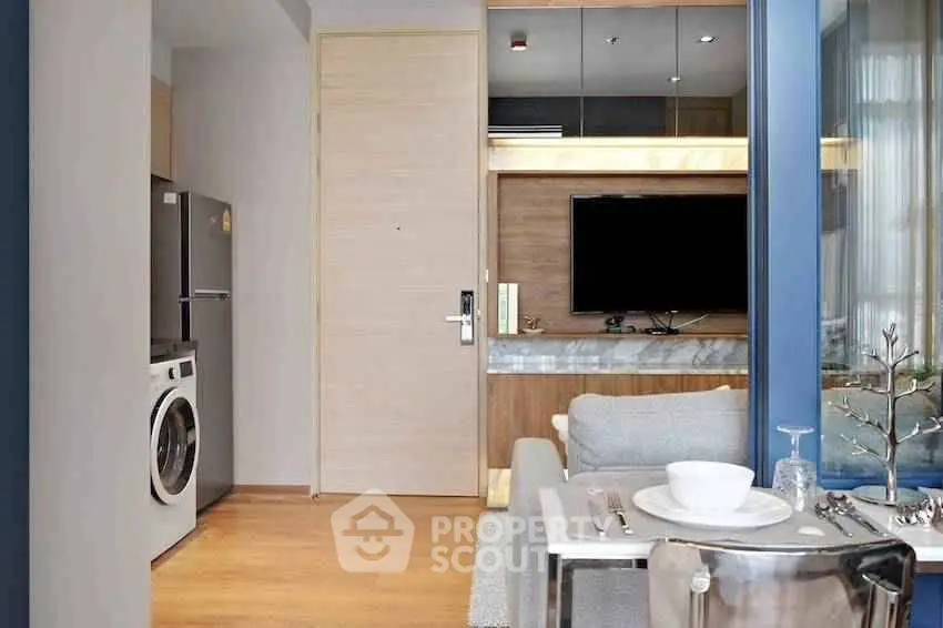 Modern apartment interior with stylish living area and kitchen appliances