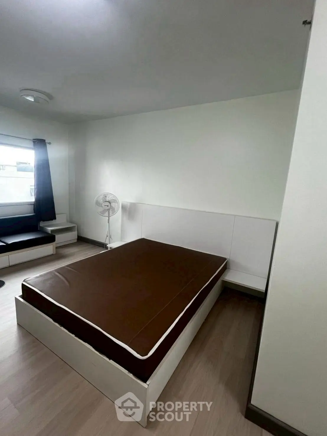 Cozy bedroom with modern furnishings and natural light