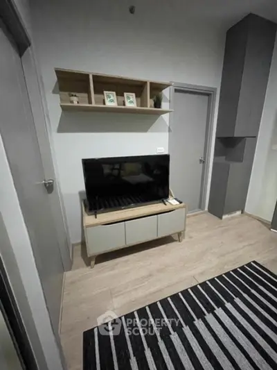 Modern living room with sleek TV stand and stylish shelving
