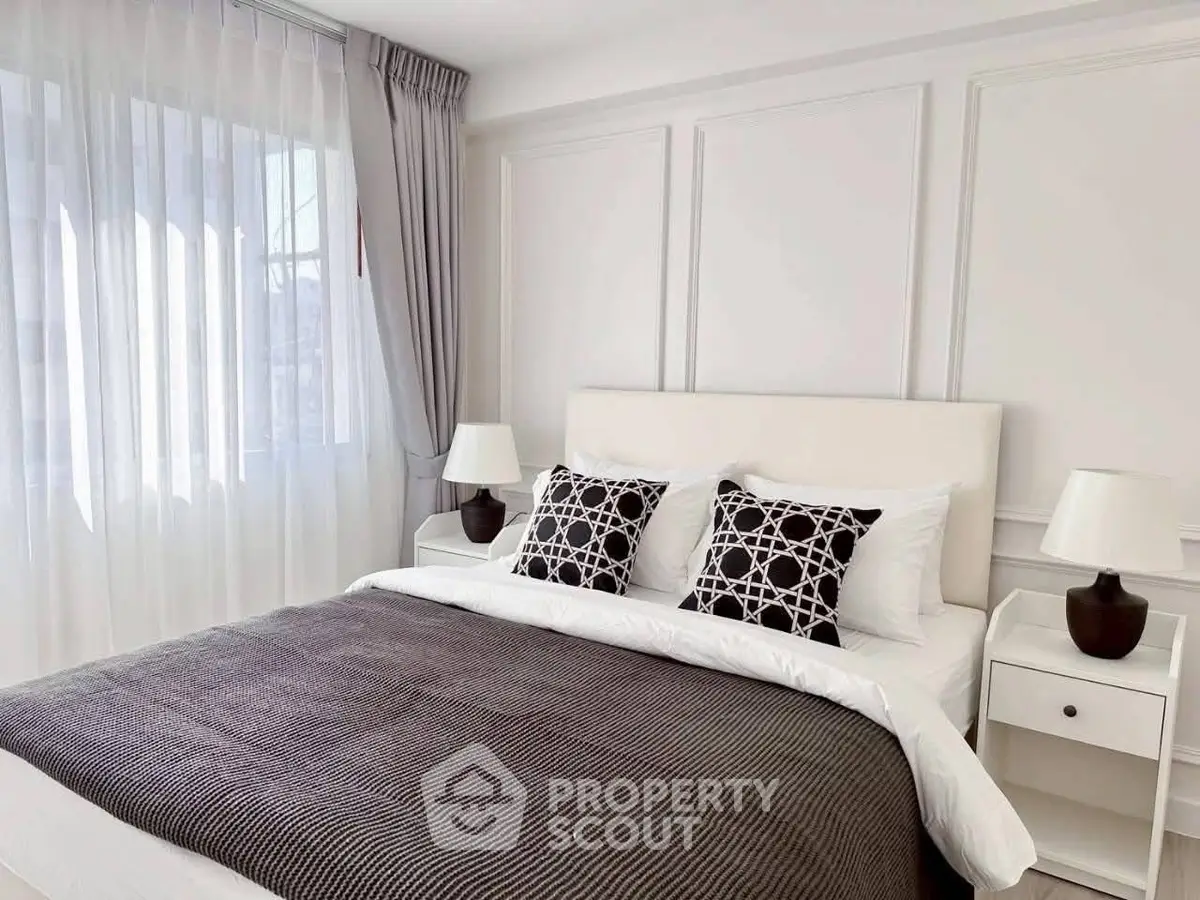 Elegant bedroom with modern decor and natural light