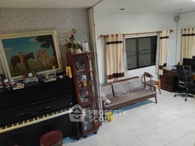 Charming living room with piano and elegant decor, perfect for relaxation and entertainment.