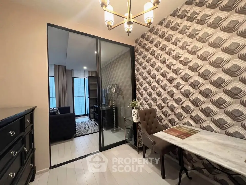 Stylish modern living room with unique wallpaper and elegant furniture