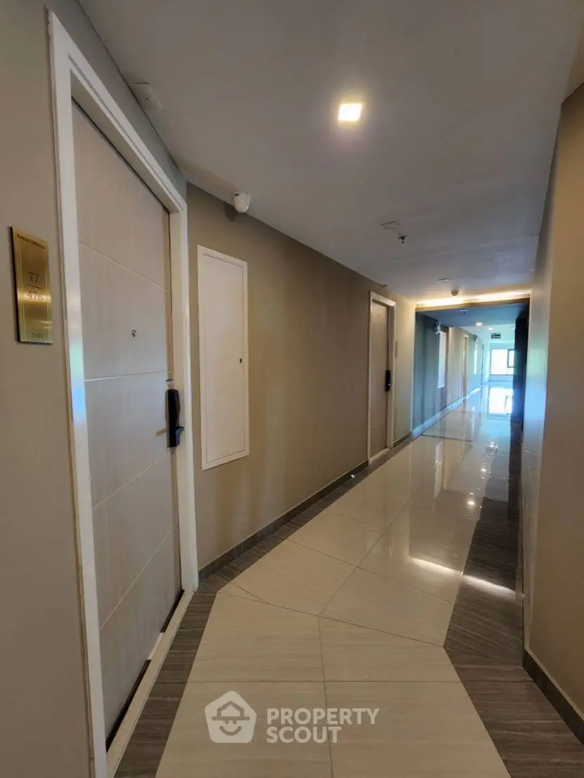 Modern apartment hallway with sleek design and polished floors
