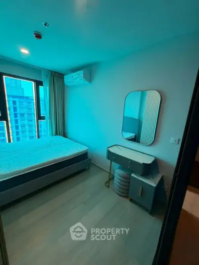 Modern bedroom with large window and stylish furniture in high-rise apartment