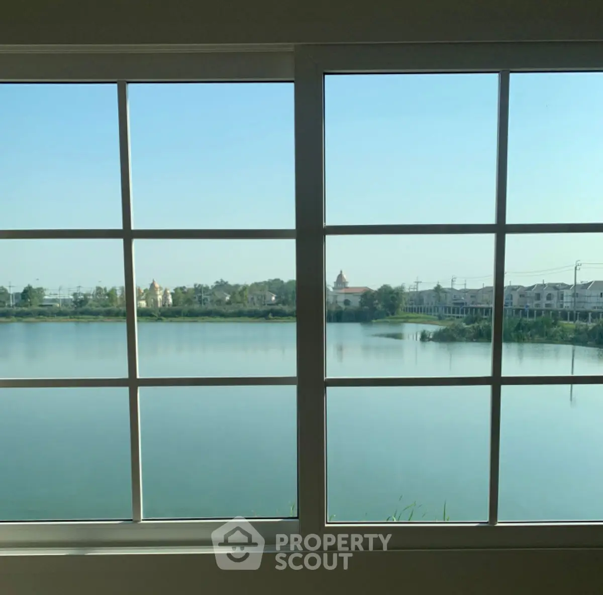 Stunning lake view from large window in modern home