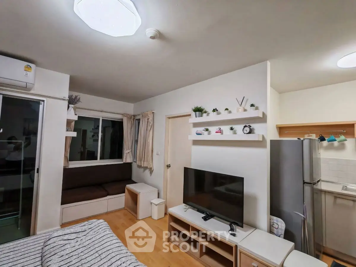 Modern living room with sleek furniture and open kitchen layout