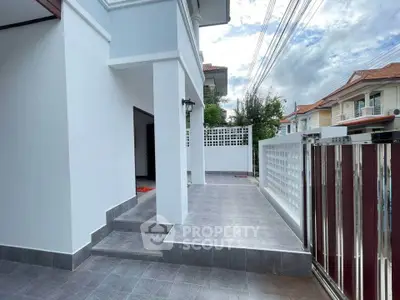 Modern house exterior with spacious driveway and elegant entrance