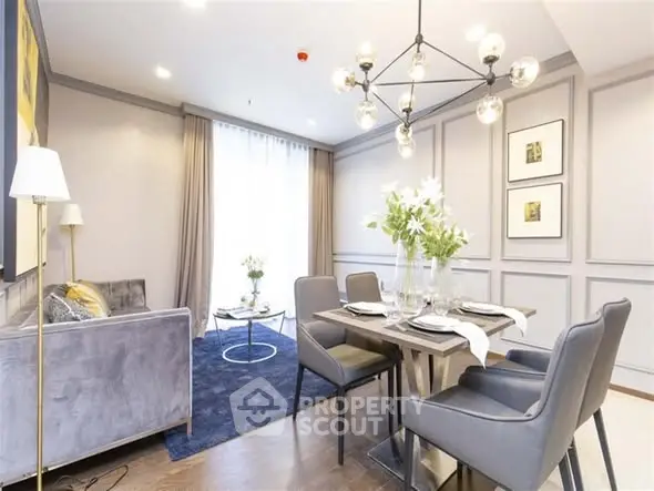 Elegant living room with modern dining area and stylish chandelier