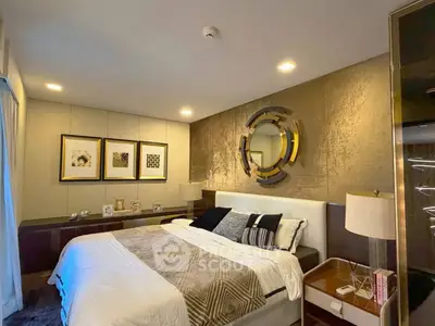 Luxurious bedroom with modern decor and elegant lighting, perfect for relaxation and comfort.
