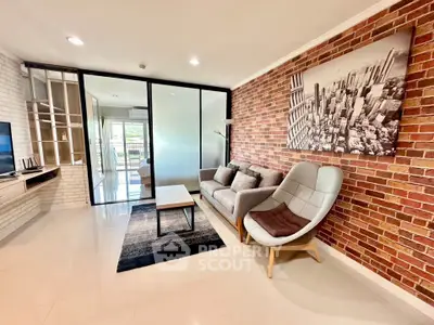 Stylish living room with brick accent wall and modern furniture