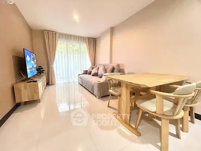 Modern living room with cozy sofa and dining area, bright natural light, elegant decor.