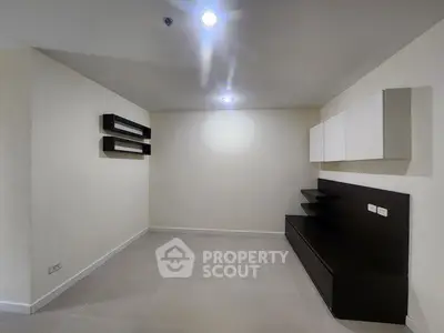 Minimalist living room with modern wall shelves and sleek storage unit