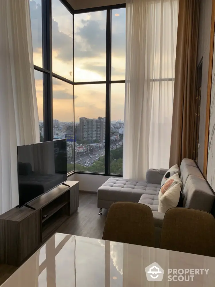 Modern living room with panoramic city view and stylish furniture