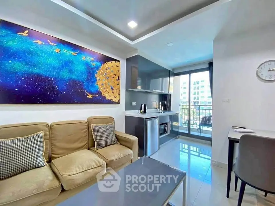 Modern living room with stylish decor and balcony view in urban apartment.