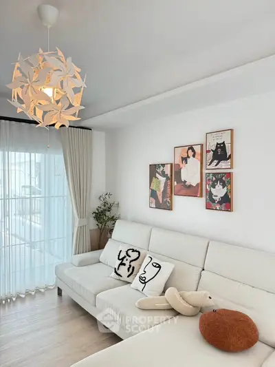 Modern living room with stylish decor and unique lighting fixture