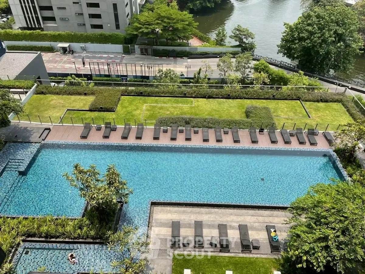 Luxurious rooftop pool with sun loungers and stunning city view