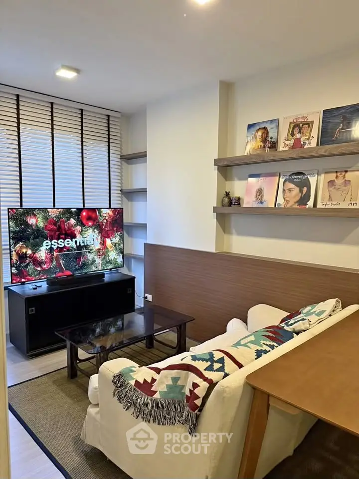 Cozy living room with modern decor and entertainment setup, perfect for relaxation and leisure.