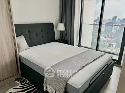 Modern bedroom with city view and stylish decor