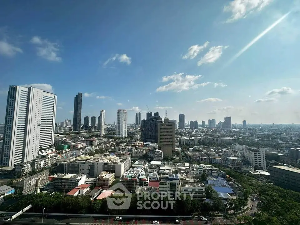 Stunning cityscape view showcasing modern skyscrapers under a clear blue sky, perfect for urban living.