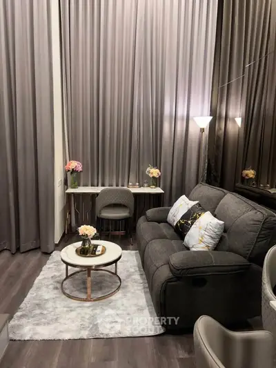 Luxurious living room with high ceilings, elegant decor, and plush seating for ultimate comfort.
