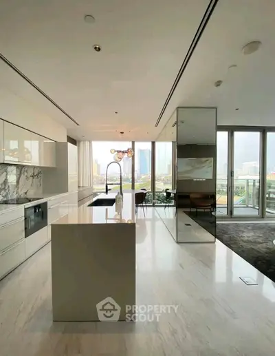 Luxurious modern kitchen with marble island and stunning city view