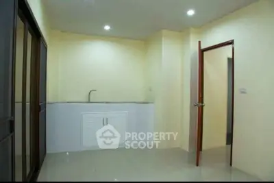 Minimalist kitchen with closed layout and sleek design