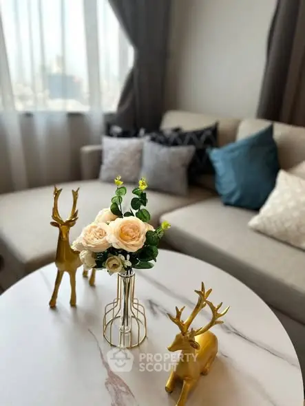 Stylish living room with elegant decor and cozy seating area.