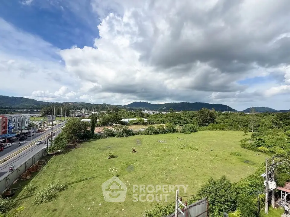 Expansive green land with scenic mountain views, perfect for development opportunities.