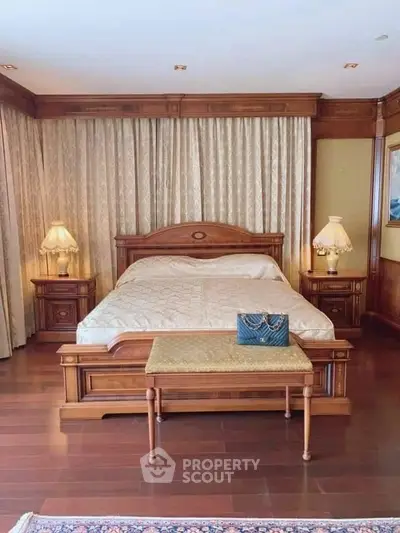 Luxurious bedroom with elegant wooden furniture and ambient lighting