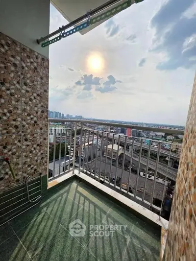 Stunning balcony view with cityscape and sunset, perfect for relaxation and enjoying the skyline.