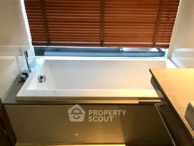 Luxurious bathroom with modern bathtub and elegant blinds