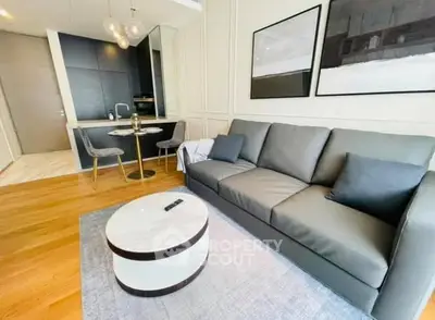Modern living room with sleek furniture and open kitchen layout