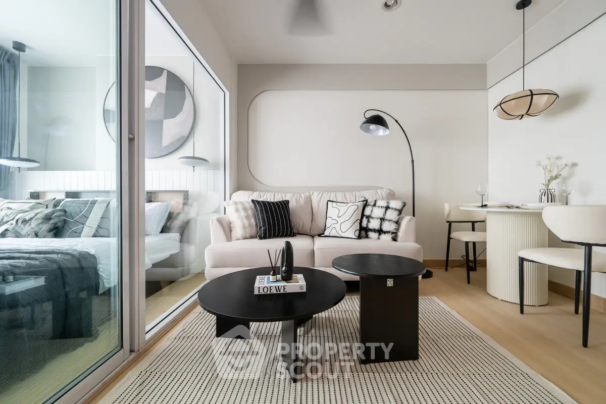 Modern living room with stylish decor and open layout adjacent to bedroom