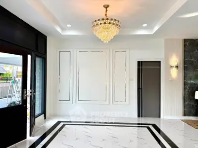 Luxurious modern living room with elegant chandelier and marble flooring