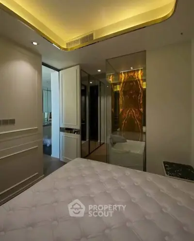 Luxurious bedroom with modern lighting and elegant decor