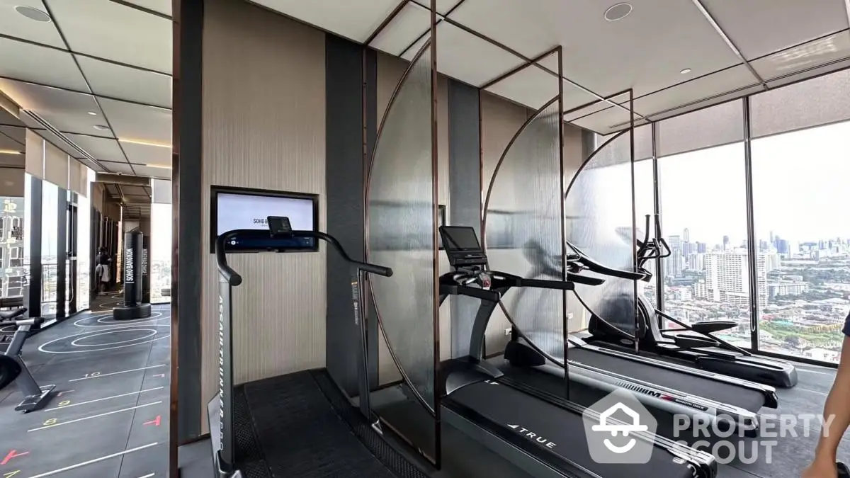 Luxury high-rise gym with panoramic city views and modern fitness equipment.