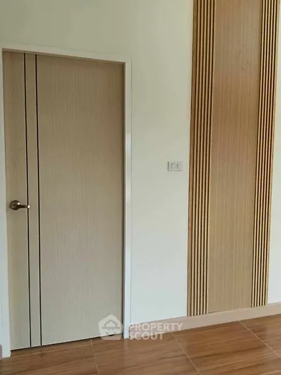Modern interior with wooden door and stylish wall paneling