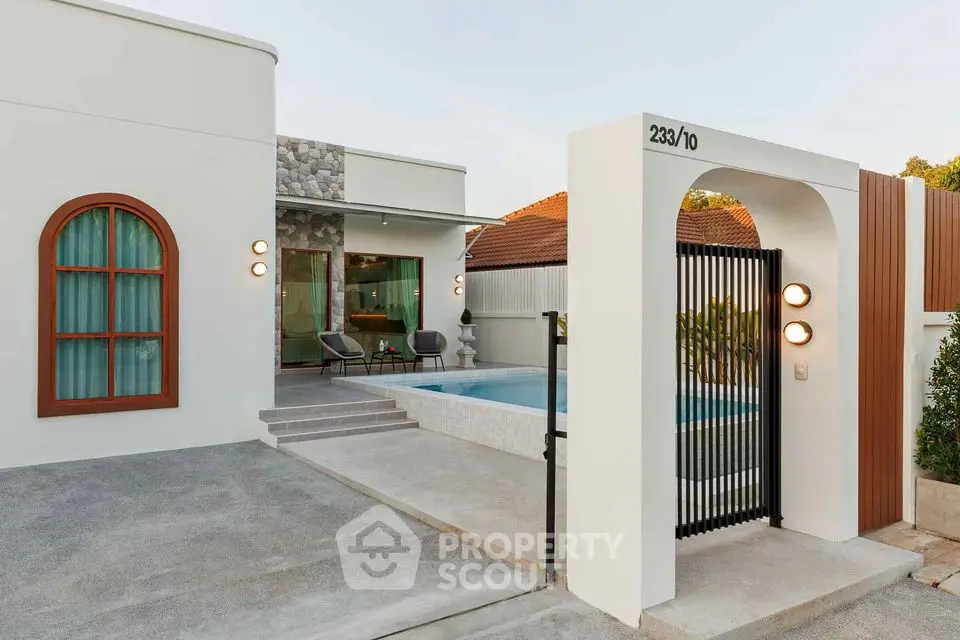Modern villa exterior with pool and stylish entrance, perfect for luxury living.