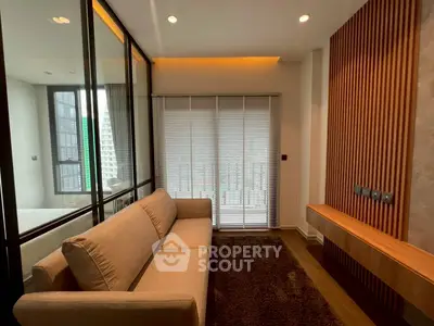 Modern living room with sleek design and floor-to-ceiling windows