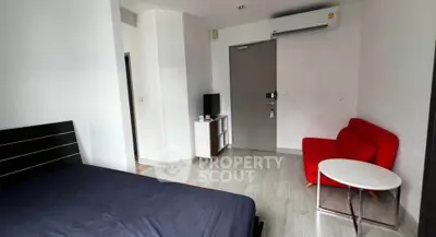 Modern studio apartment with sleek furnishings and air conditioning, perfect for urban living.