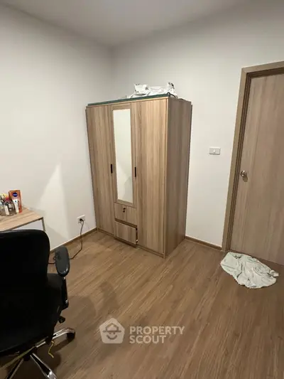 Cozy study room with wooden flooring and modern furniture