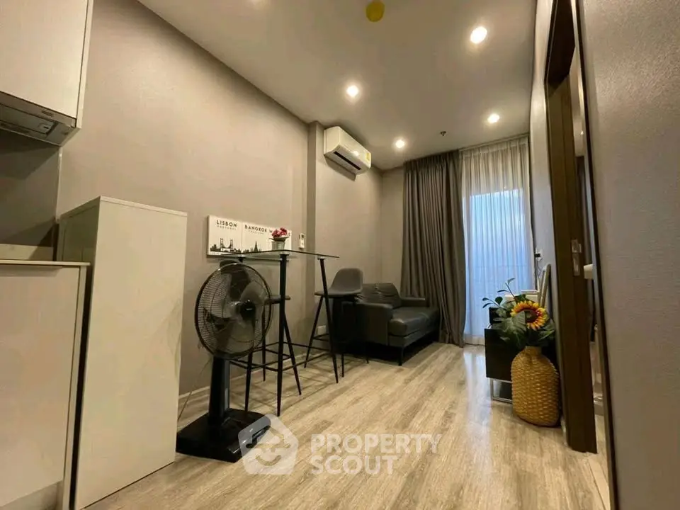 Modern living room with sleek furniture and air conditioning in a cozy apartment.