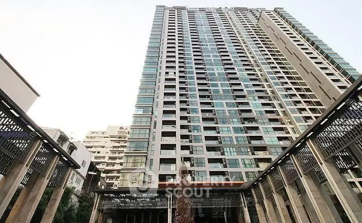 Stunning high-rise building exterior with modern architectural design and expansive windows.