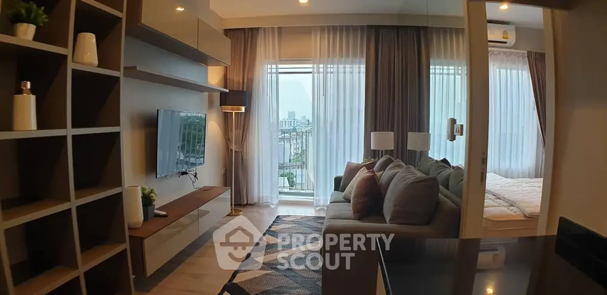 Modern living room with stylish decor and city view from balcony