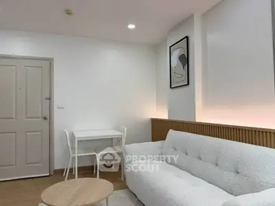 Modern living room with cozy white sofa and minimalist decor