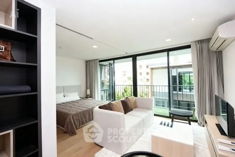 Modern studio apartment with balcony and stylish interior design