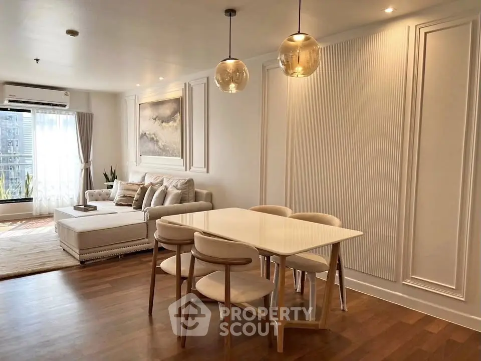 Elegant living room with modern dining area and stylish decor