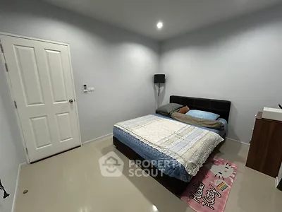 Cozy bedroom with modern decor and comfortable bed in a minimalist style.