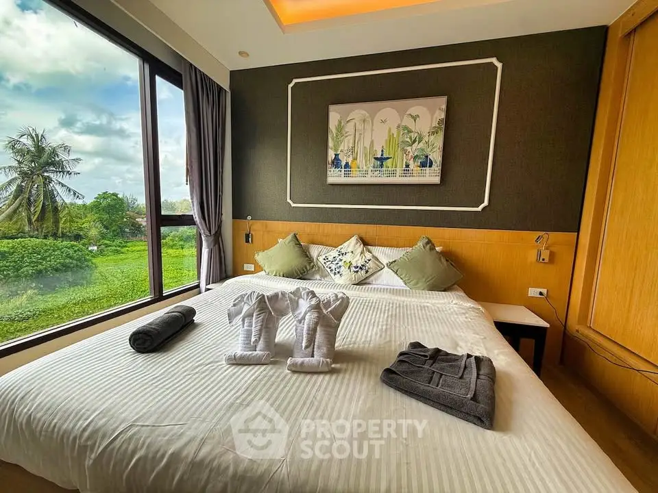 Luxurious bedroom with scenic view and elegant decor, perfect for relaxation and comfort.