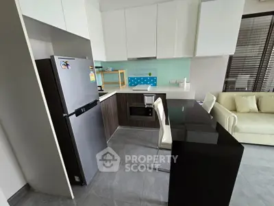 Modern kitchen with sleek appliances and stylish island seating